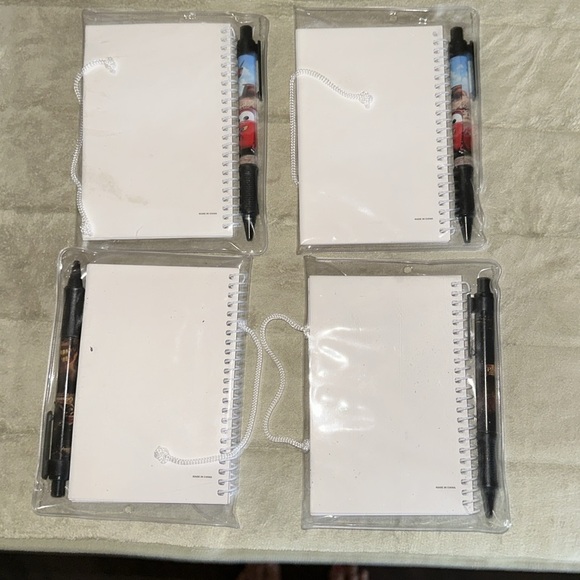 4 Small Disney Cars and Pirates of the Caribbean Notebook with matching pens. - Picture 2 of 5